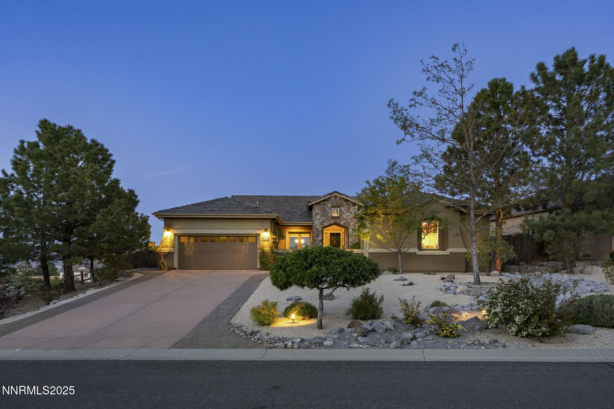 2698 Wind Feather Trail Reno, NV 89511 - Photo 24 of 44 a front view of house with yard and trees in the background