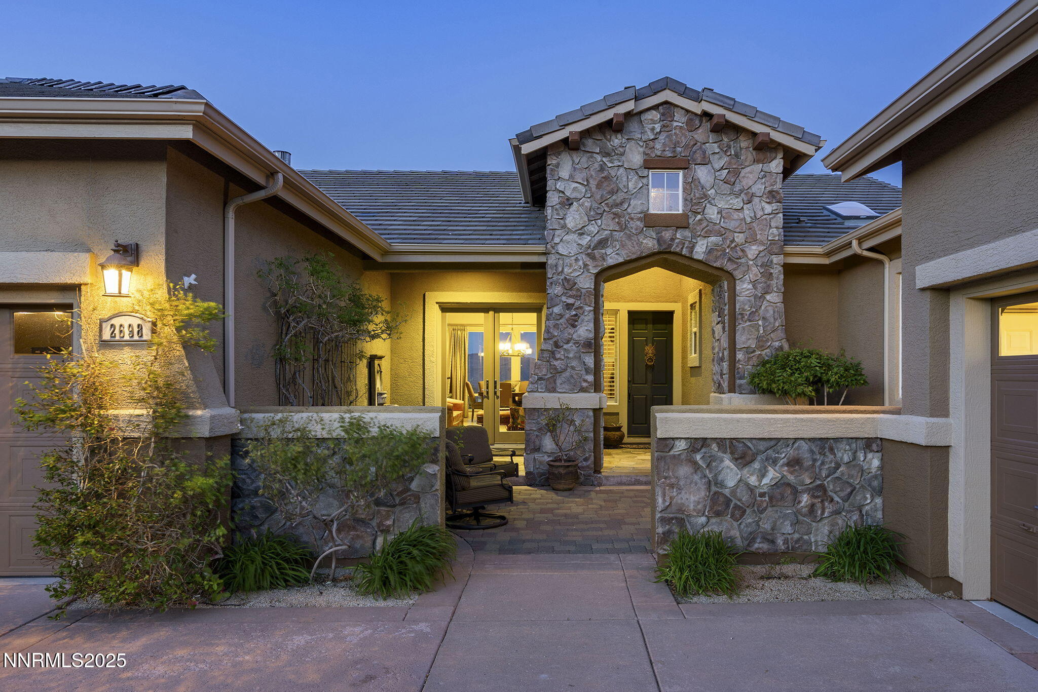 2698 Wind Feather Trail Reno, NV 89511 - Photo 25 of 44 a front view of a house with garden