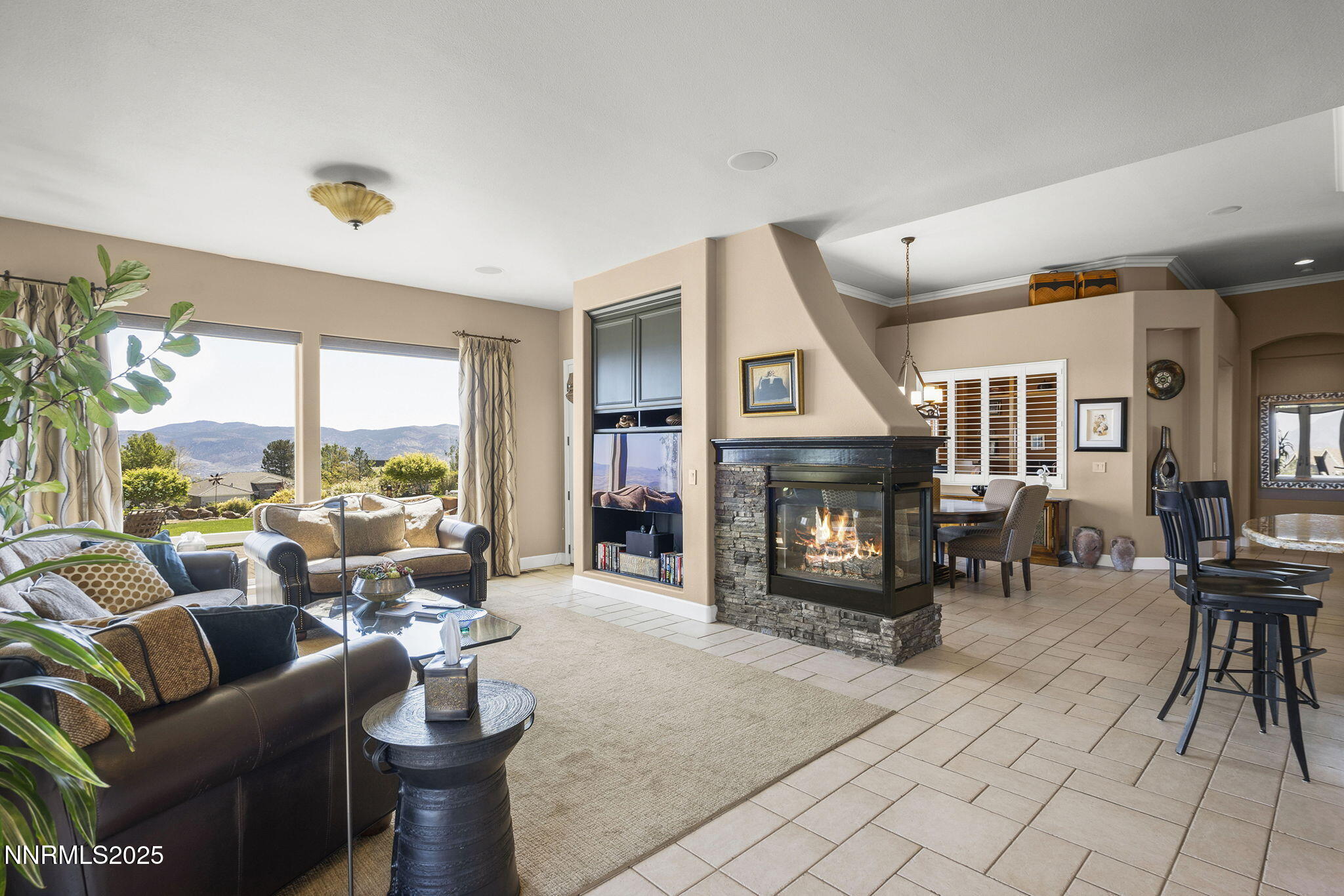 2698 Wind Feather Trail Reno, NV 89511 - Photo 3 of 44 a living room with furniture large window and a fireplace