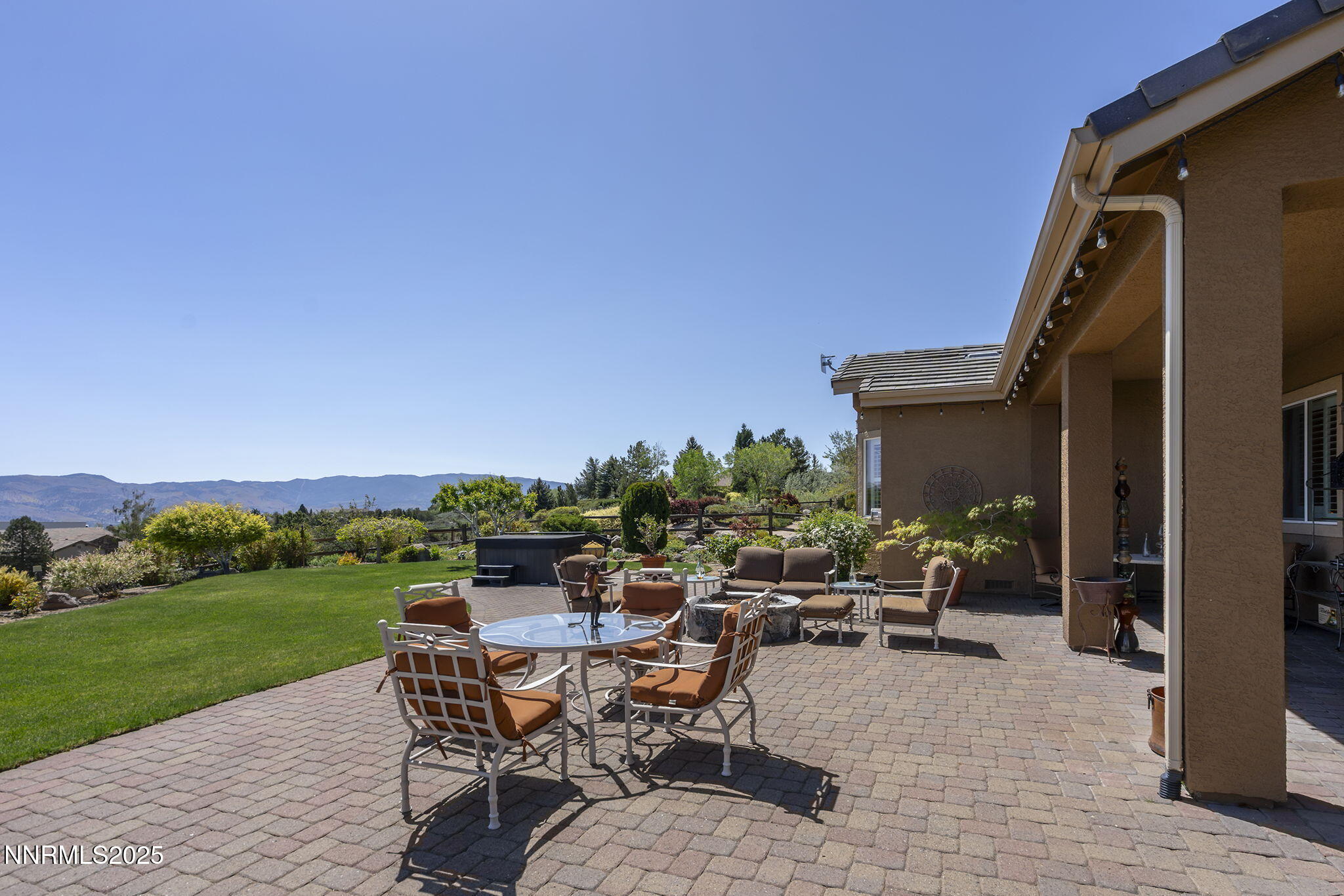 2698 Wind Feather Trail Reno, NV 89511 - Photo 40 of 44 a view of a patio with a table and chairs