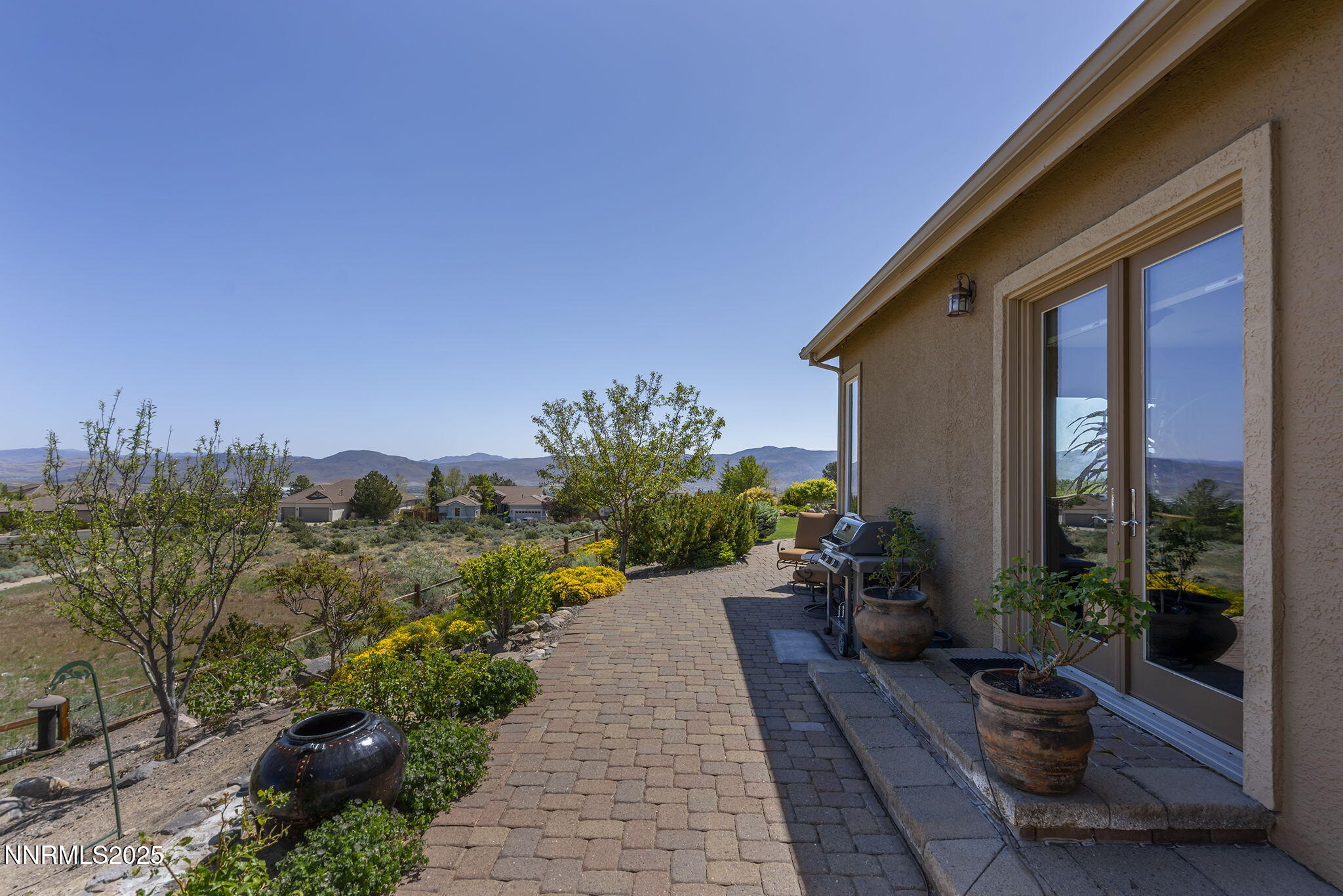 2698 Wind Feather Trail Reno, NV 89511 - Photo 43 of 44 a view of a house with backyard and sitting area
