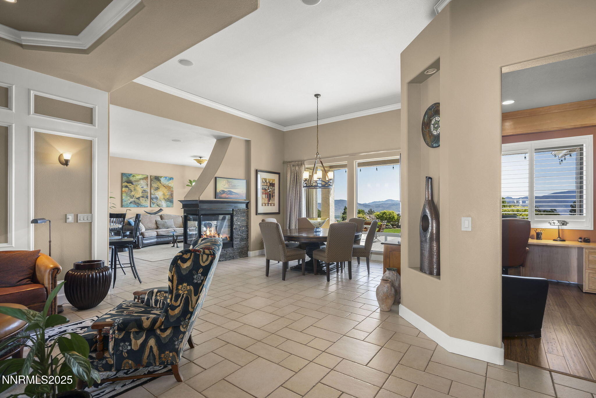 2698 Wind Feather Trail Reno, NV 89511 - Photo 6 of 44 a view of a dining room with furniture window and wooden floor