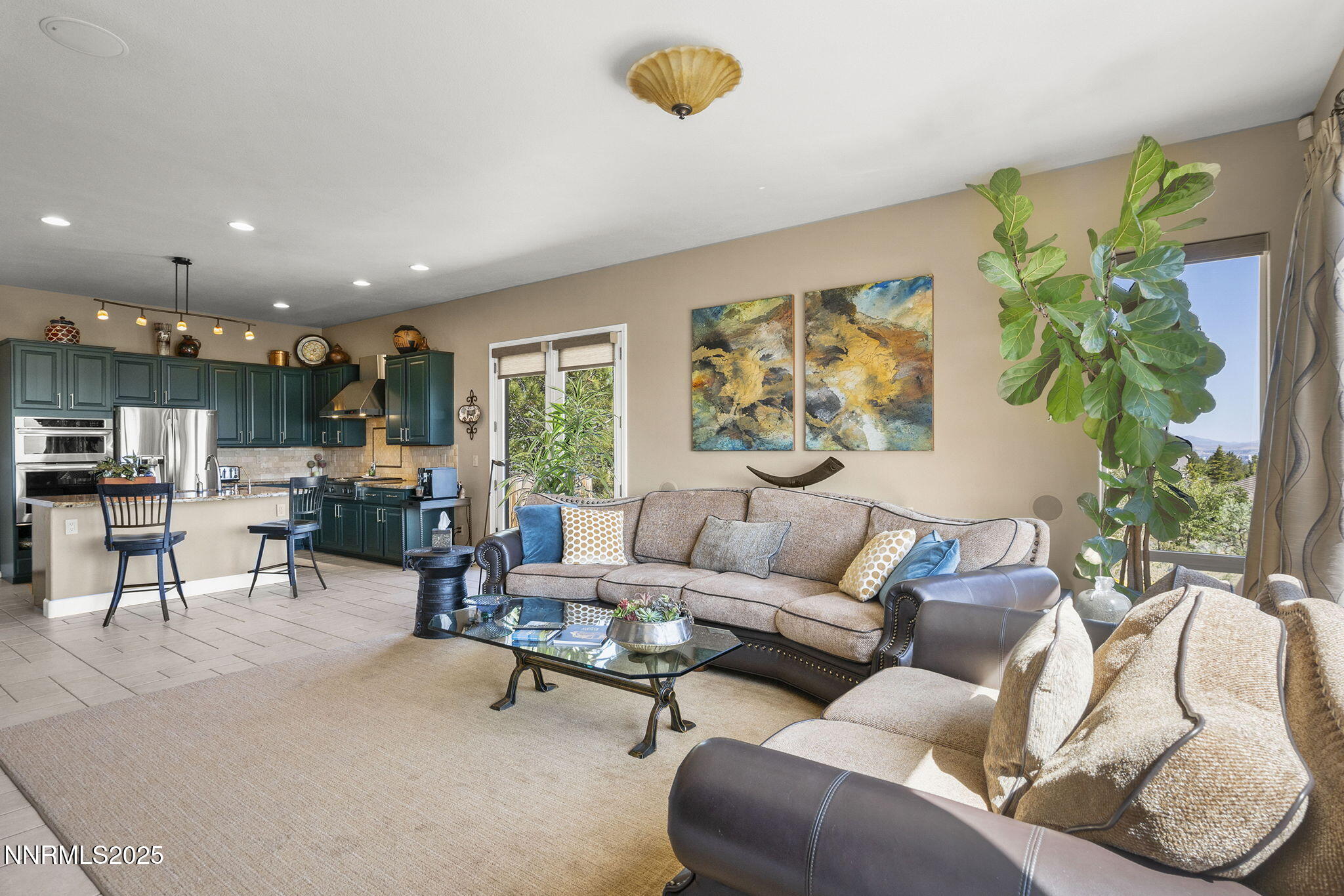2698 Wind Feather Trail Reno, NV 89511 - Photo 9 of 44 a living room with furniture and a potted plant