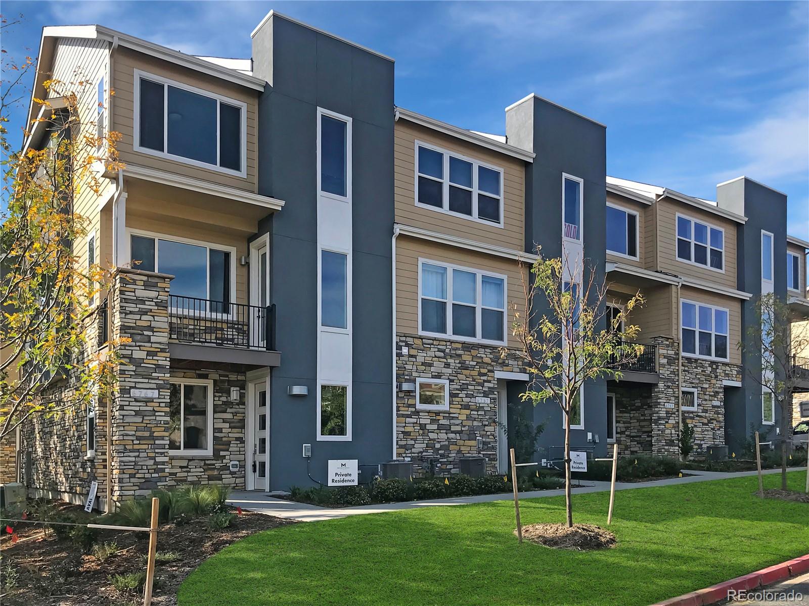 a view of a brick building with a yard