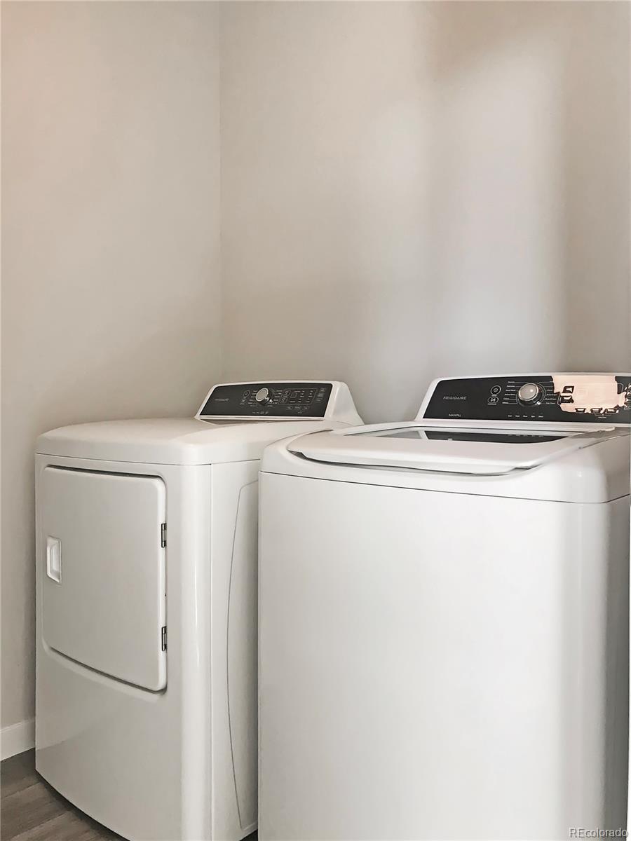 6767 South Tempe Court Aurora, CO 80016 - Photo 5 of 25 a utility room with dryer and washer