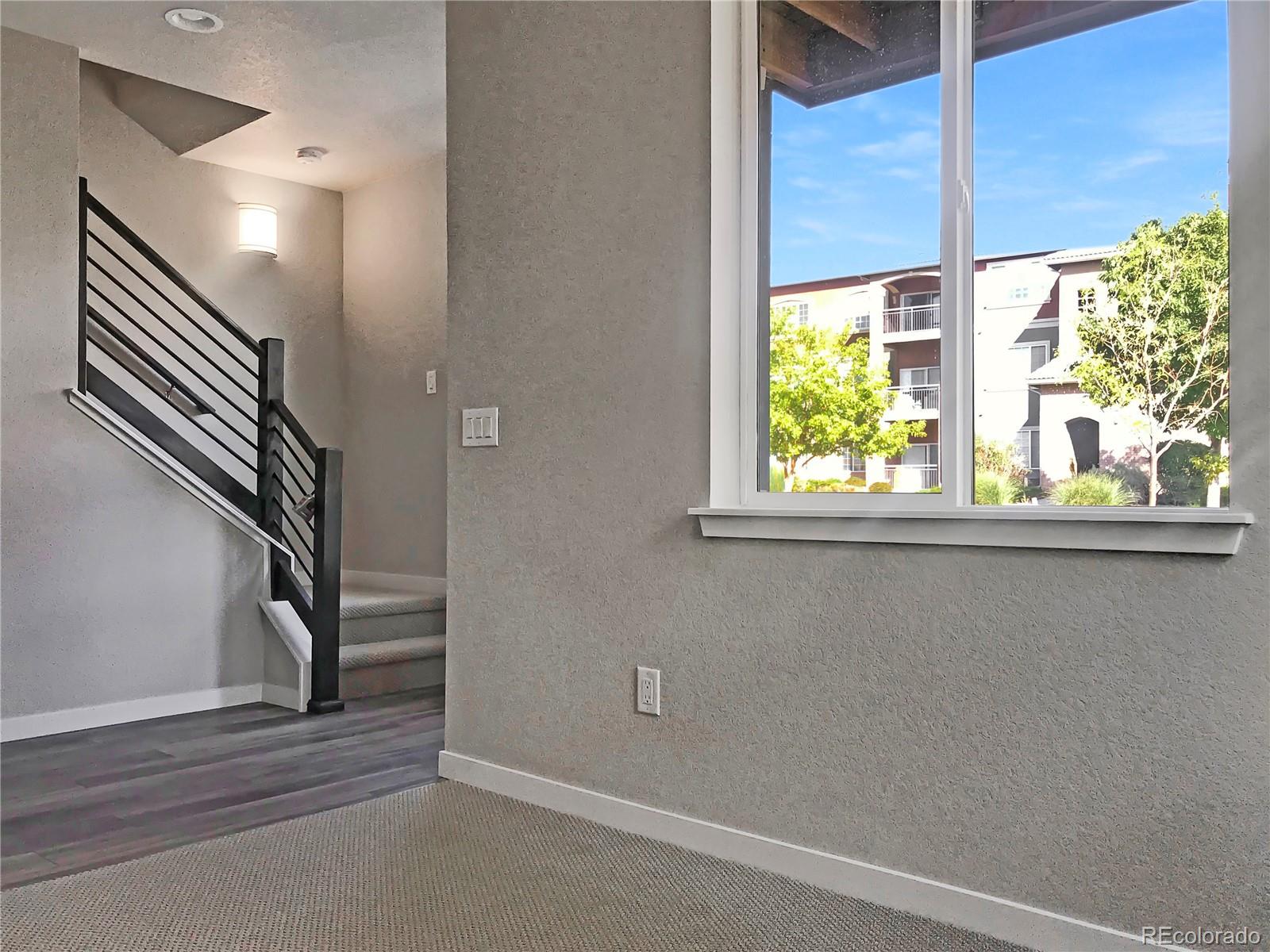 6767 South Tempe Court Aurora, CO 80016 - Photo 10 of 25 a view of empty room with stairs