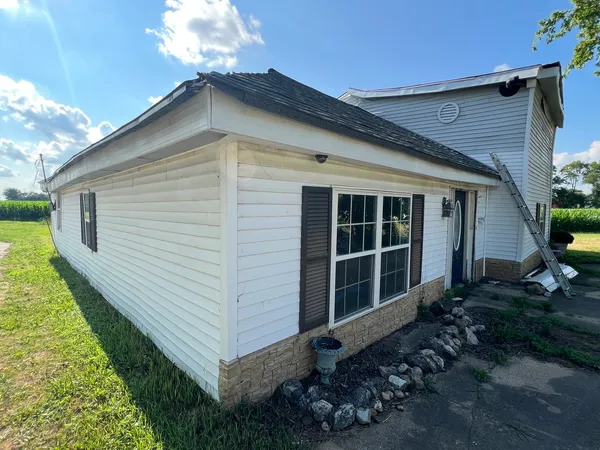 front view of a house with a yard
