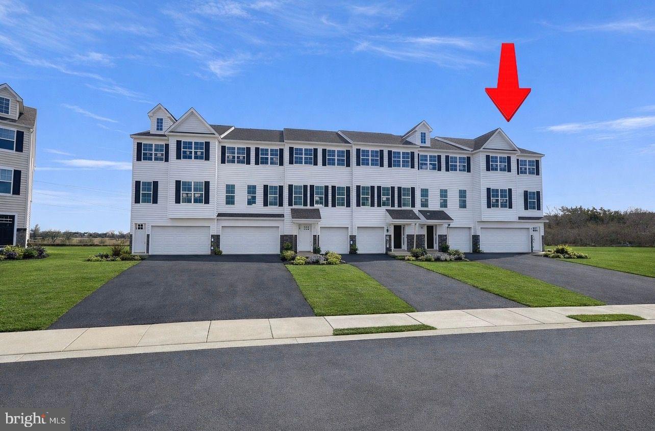 442 Rederick Lane Middletown, DE 19709 - Photo 2 of 16 a view of a big house with a yard and plants