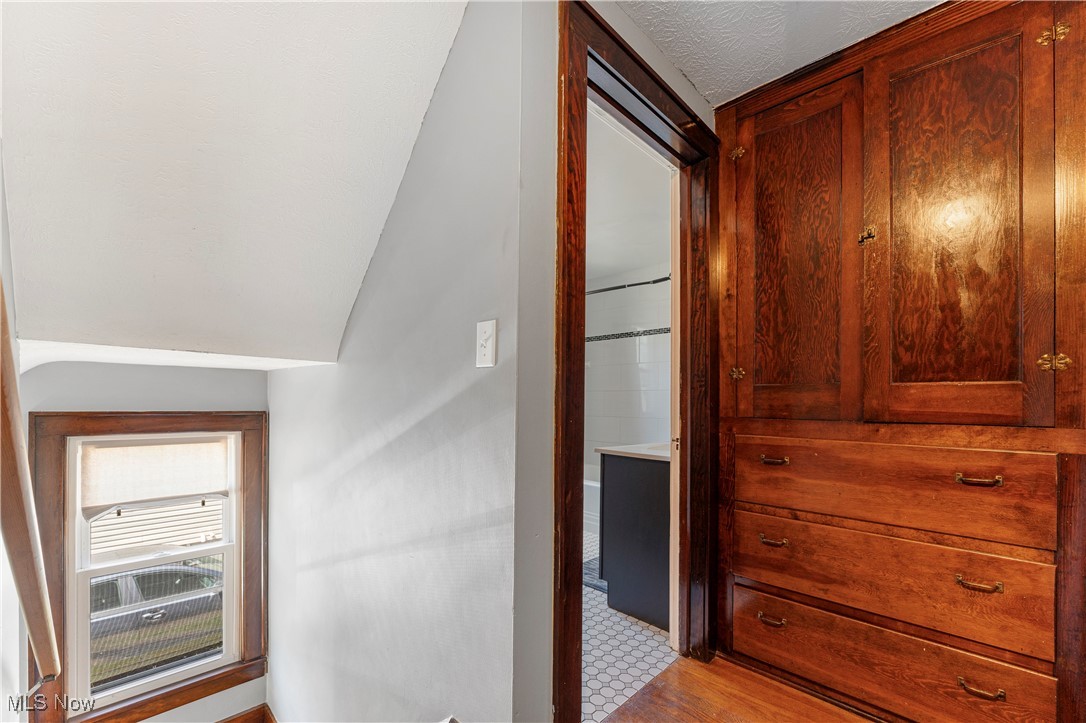 1623 Spangler Road Northeast Canton, OH 44714 - Photo 20 of 28 Hall with light wood-style flooring and vaulted ceiling