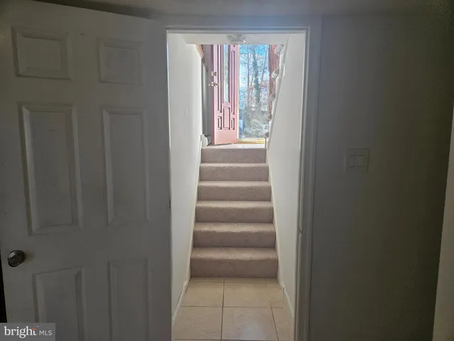 a view of entryway with wooden floor and windows