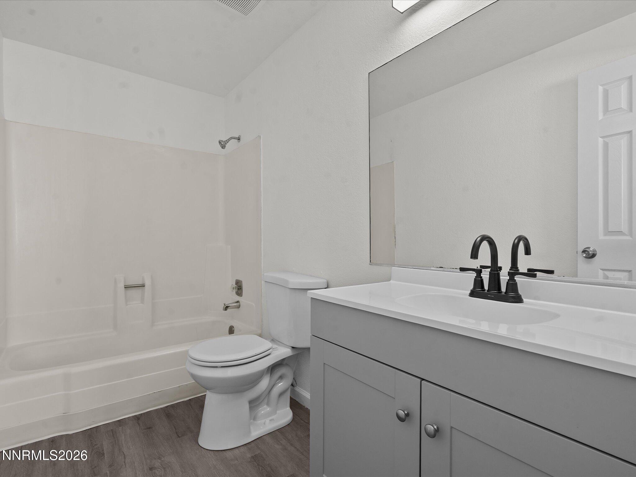 220 Allouette Way, Unit 4 Carson City, NV 89701 - Photo 16 of 22 a bathroom with a sink a toilet and a bathtub