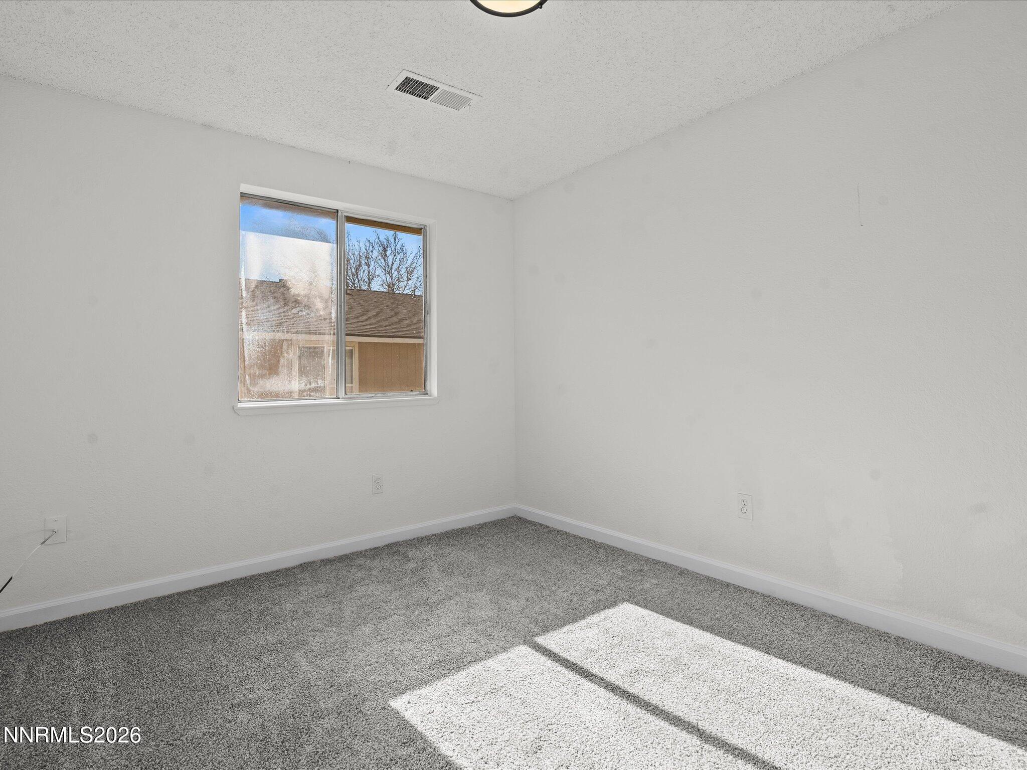 220 Allouette Way, Unit 4 Carson City, NV 89701 - Photo 18 of 22 an empty room with windows
