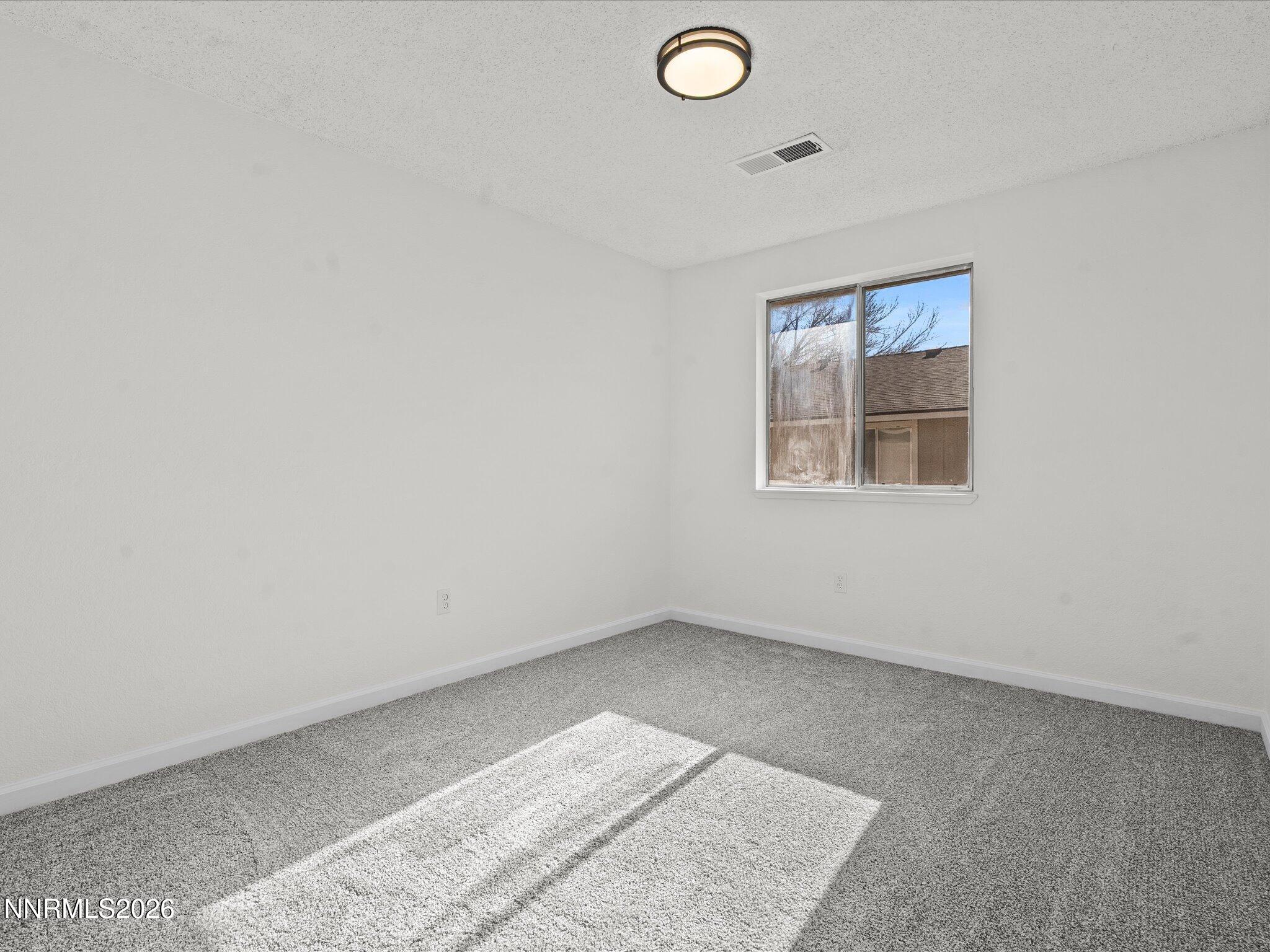 220 Allouette Way, Unit 4 Carson City, NV 89701 - Photo 20 of 22 an empty room with windows