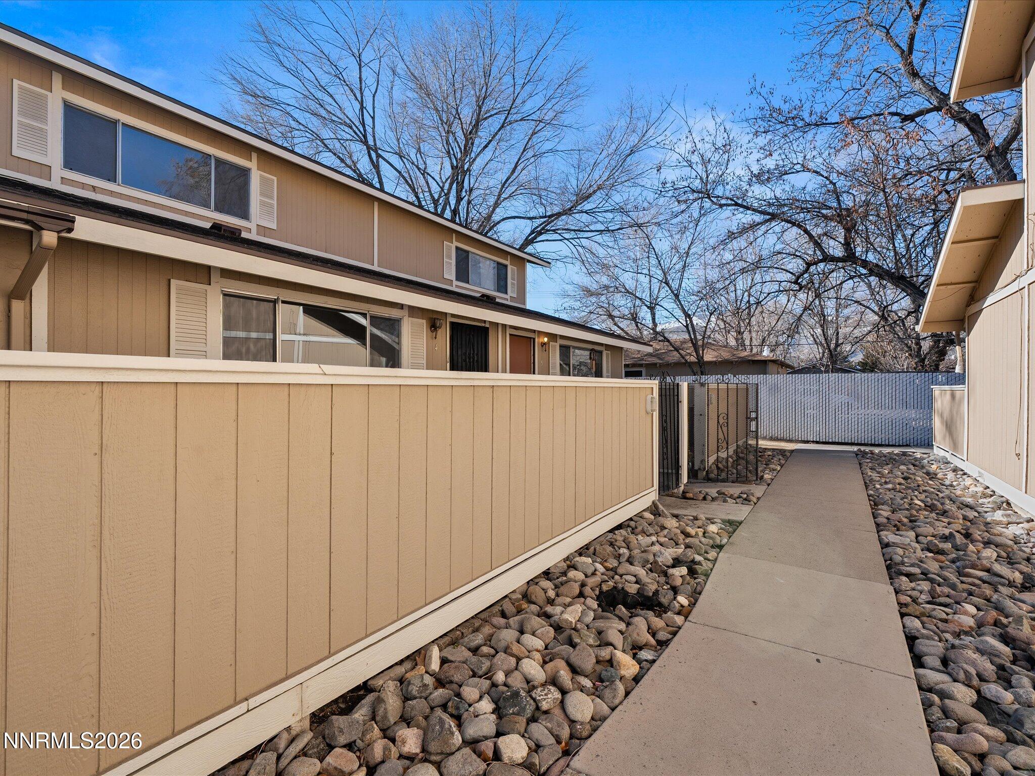 220 Allouette Way, Unit 4 Carson City, NV 89701 - Photo 3 of 22 a front view of a house with a yard