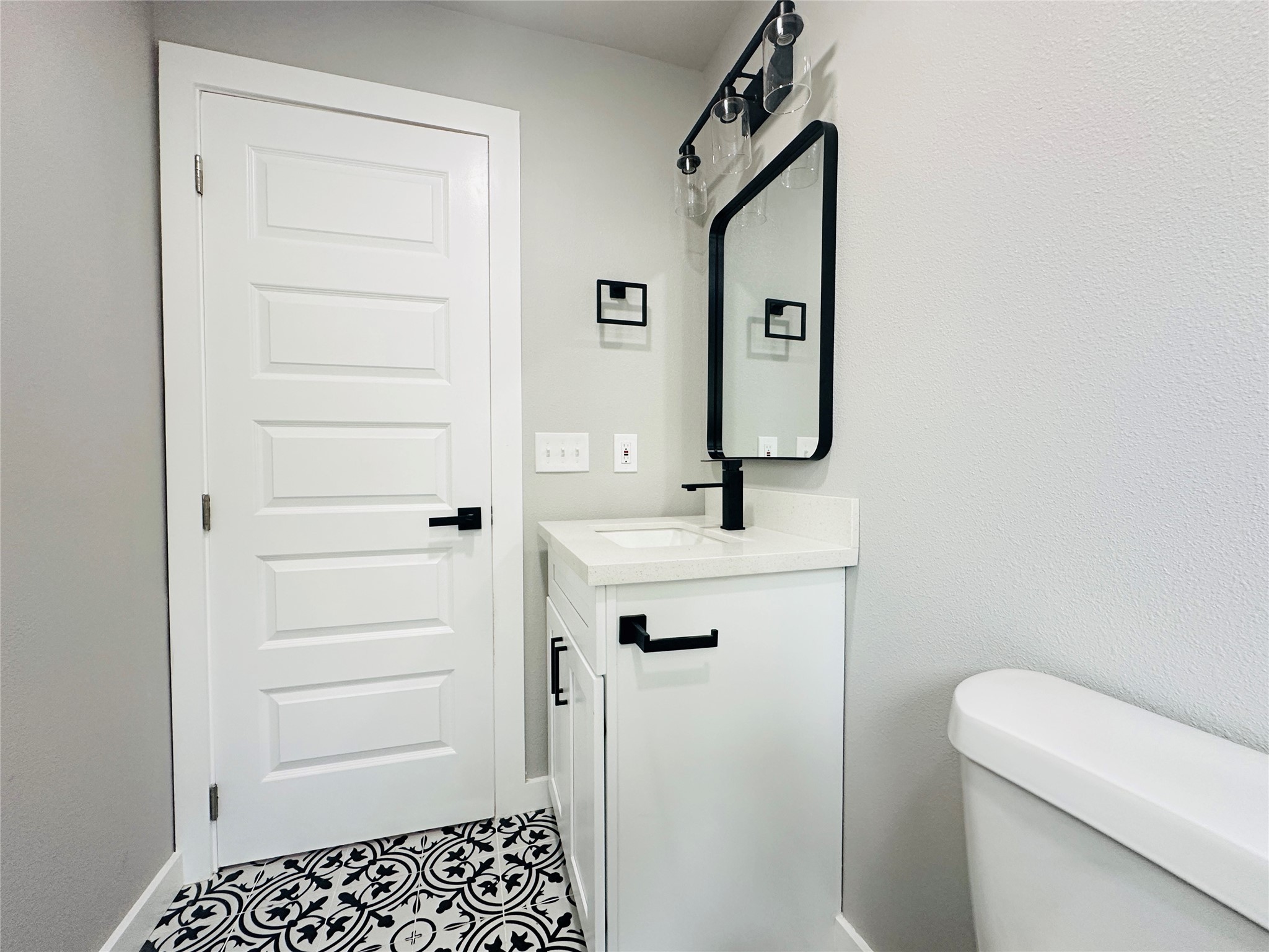 4018 Gano Street, Unit 2 Houston, TX 77009 - Photo 12 of 17 a bathroom with a sink a toilet and mirror