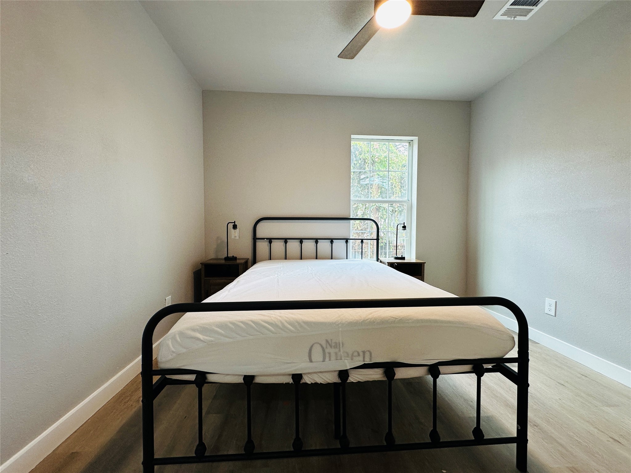 4018 Gano Street, Unit 2 Houston, TX 77009 - Photo 15 of 17 a bedroom with a bed and a window