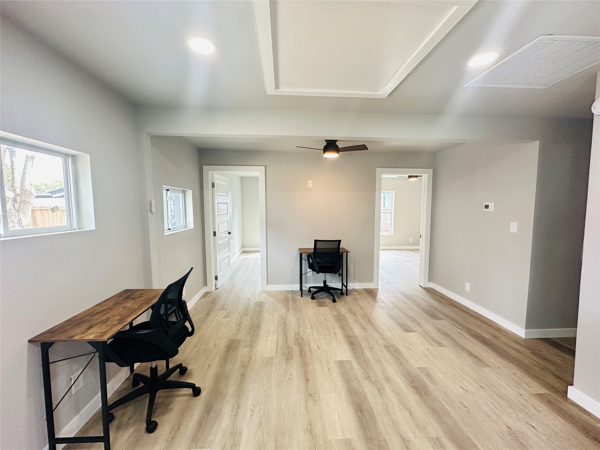 4018 Gano Street, Unit 2 Houston, TX 77009 - Photo 7 of 17 a view of a workspace with furniture and a wooden floor