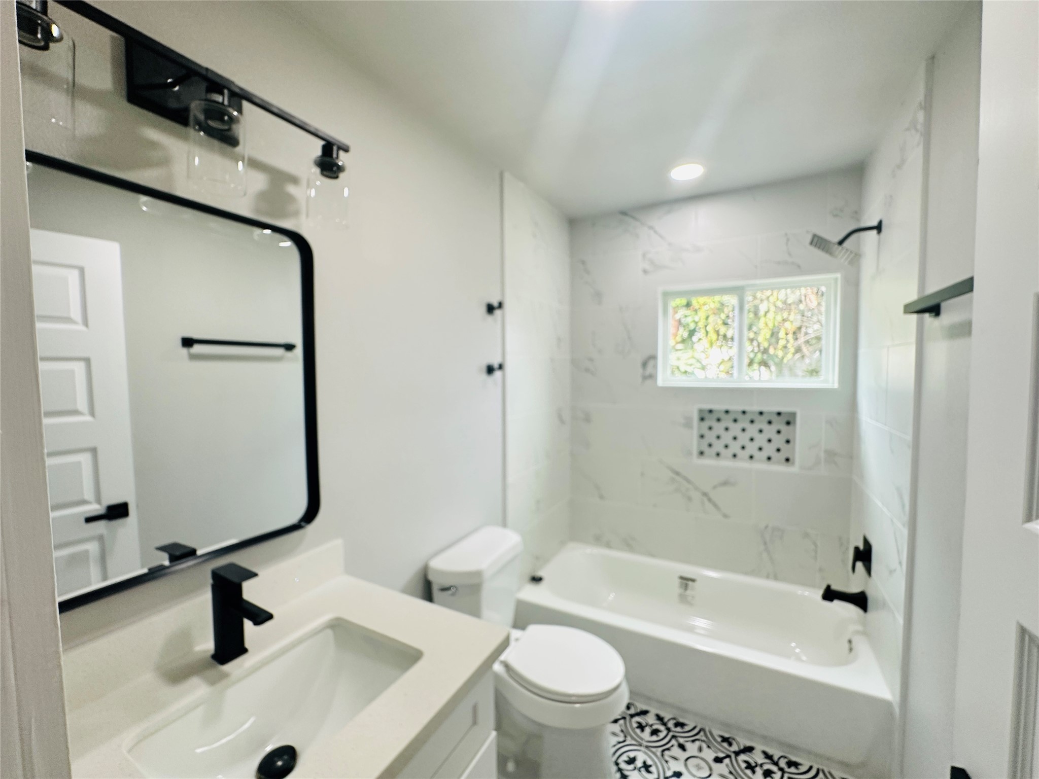 4018 Gano Street, Unit 2 Houston, TX 77009 - Photo 10 of 17 a bathroom with a sink a toilet and shower
