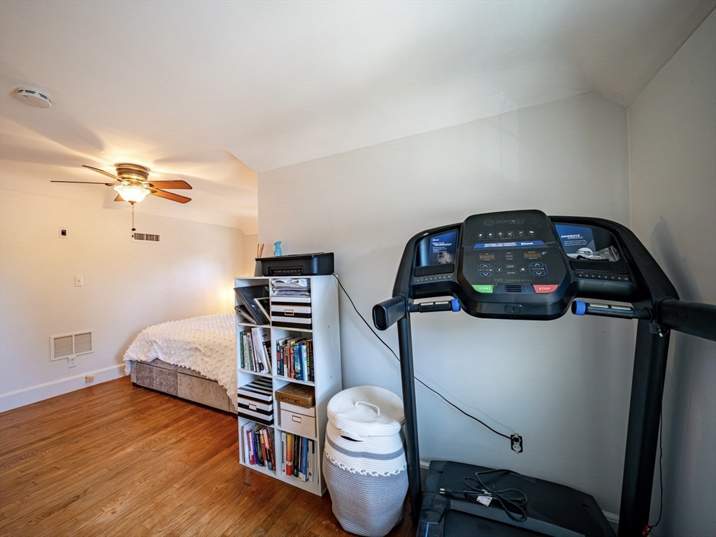 10 Guild Road Saugus, MA 01906 - Photo 26 of 32 a bedroom with a bed and wooden floor