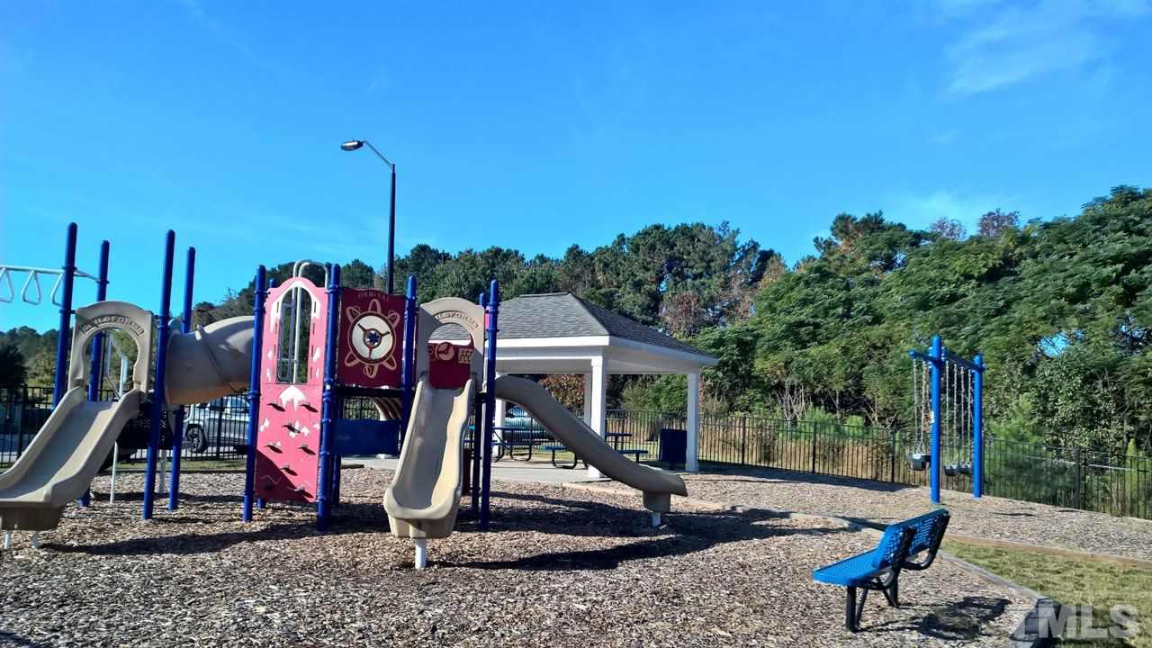 5619 Wade Park Boulevard Raleigh, NC 27607 - Photo 11 of 11 a view of a park with swings