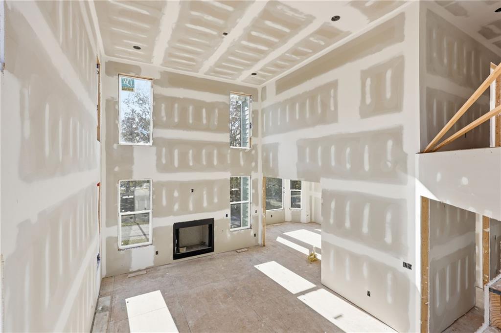 3613 Schofield Road Gainesville, GA 30506 - Photo 18 of 42 a living room with furniture a fireplace and a flat screen tv