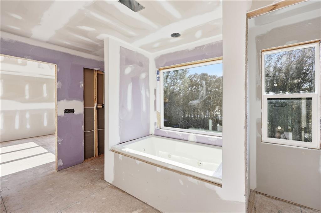 3613 Schofield Road Gainesville, GA 30506 - Photo 27 of 42 a bathroom with a bathtub and a shower