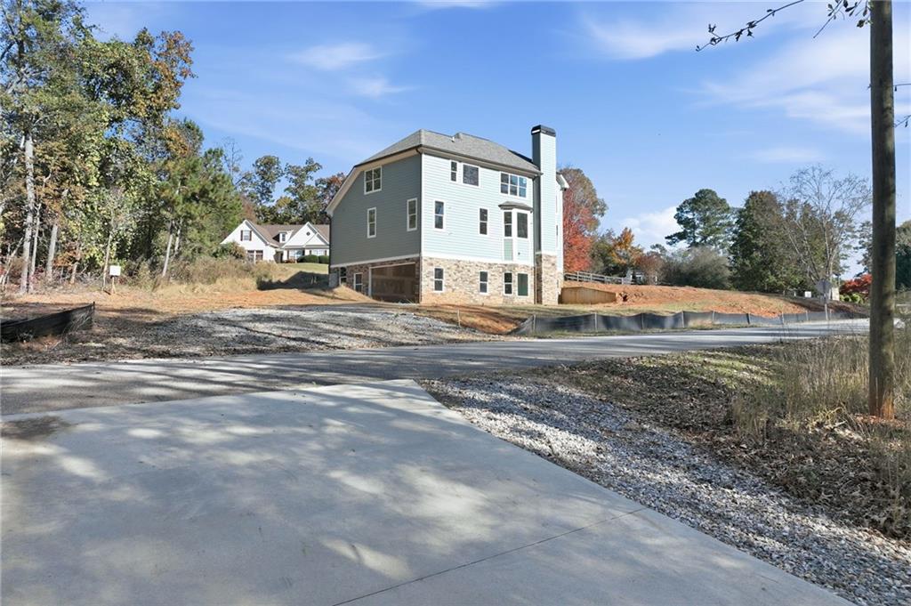 3613 Schofield Road Gainesville, GA 30506 - Photo 34 of 42 a view of a house with a yard