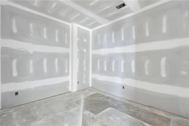 a street view with large trees