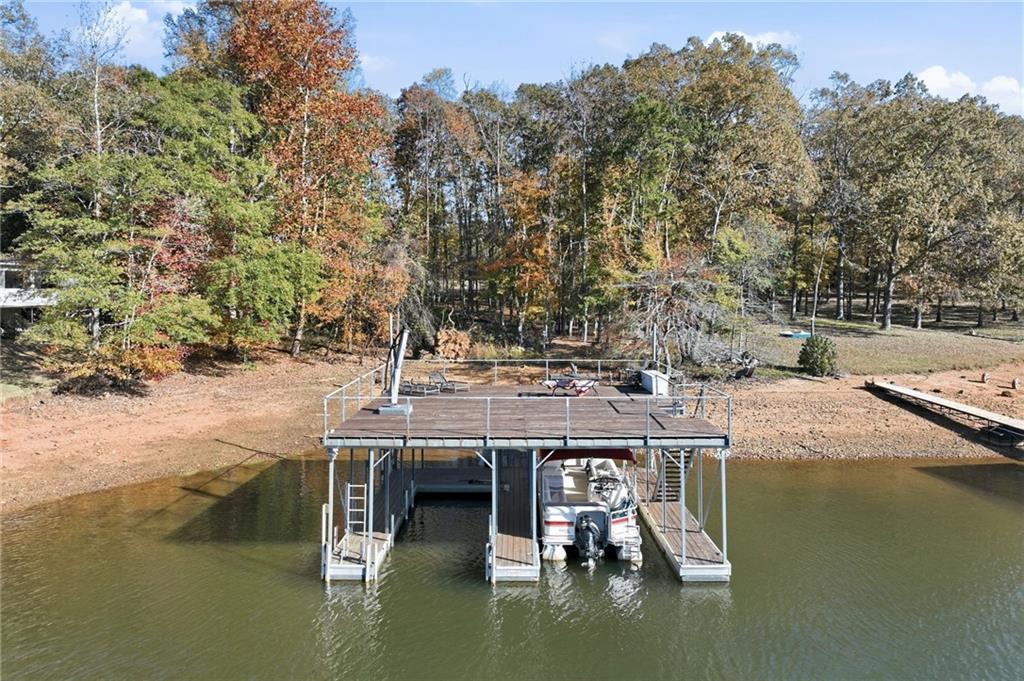 3613 Schofield Road Gainesville, GA 30506 - Photo 7 of 42 a view of house with lake view and trees
