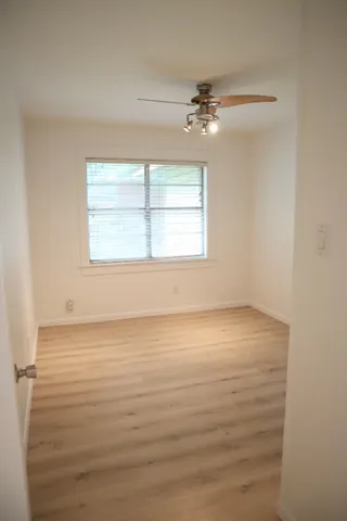 an empty room with a empty space and a window