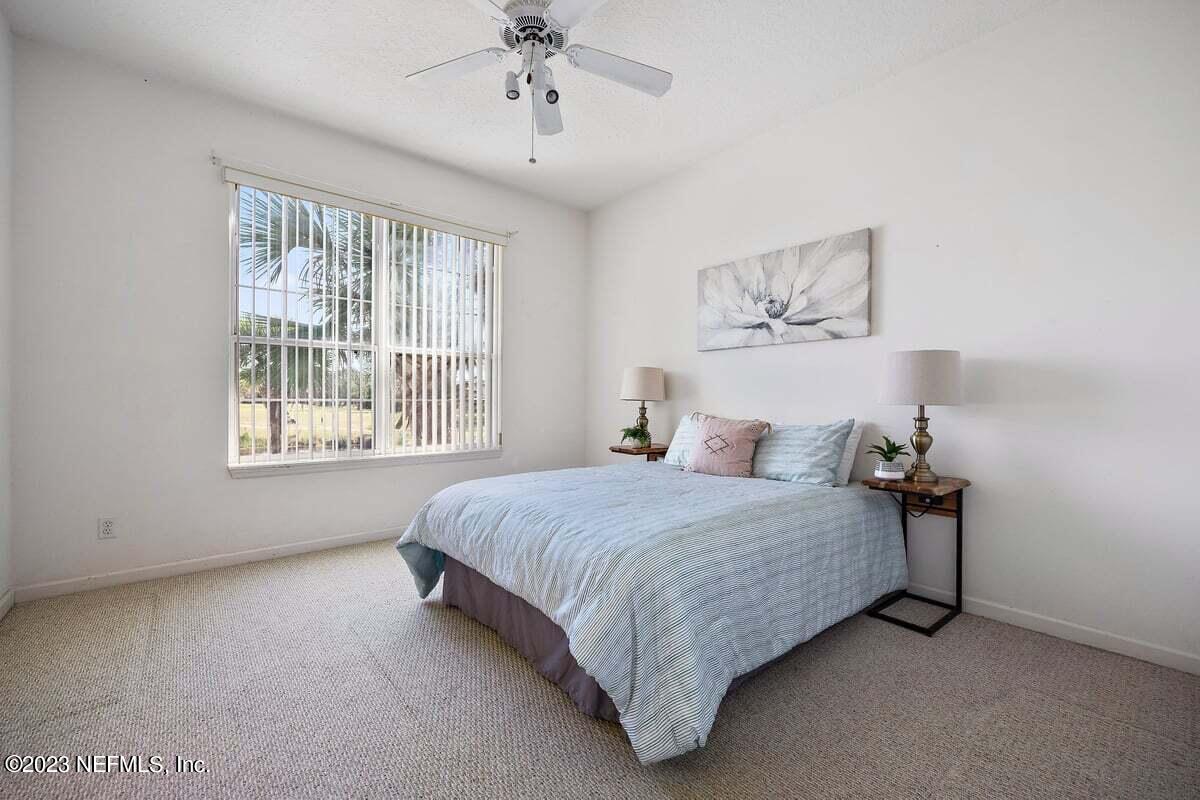 811 Pine Valley Place St. Augustine, FL 32086 - Photo 17 of 30 a bedroom with a bed and a window