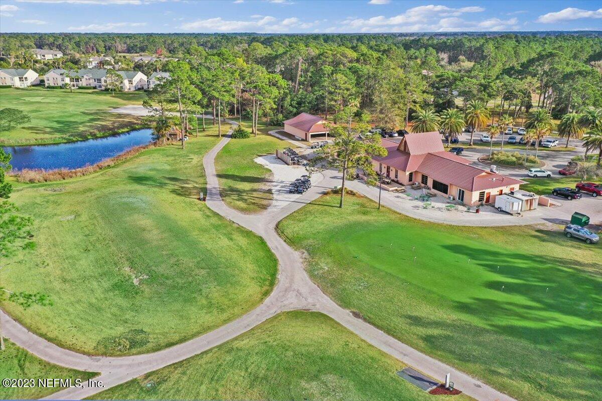811 Pine Valley Place St. Augustine, FL 32086 - Photo 22 of 30 a view of a swimming pool with a yard and outdoor seating