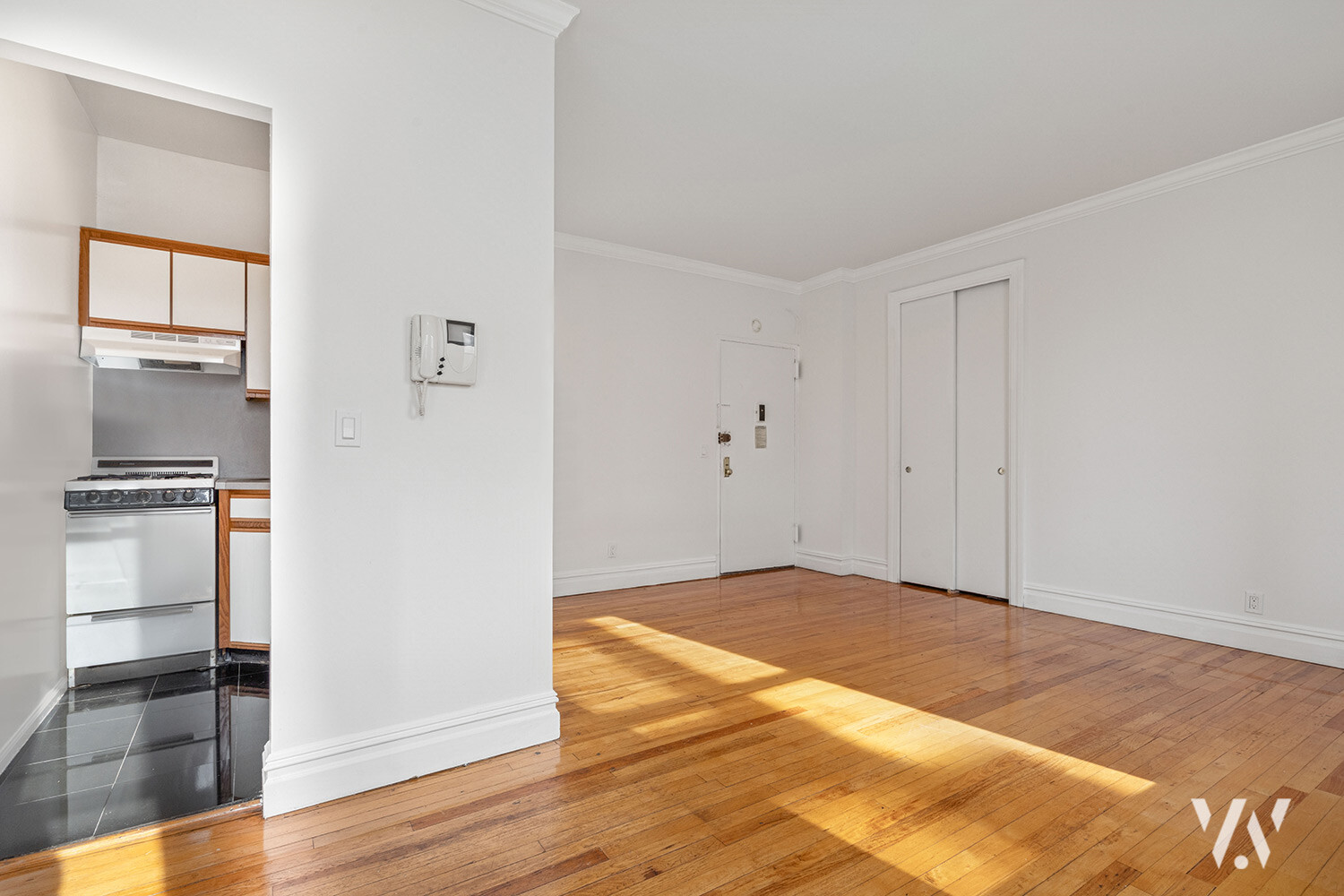 112 West 72nd Street, Unit 12E Manhattan, NY 10023 - Photo 4 of 11 a view of empty room with wooden floor