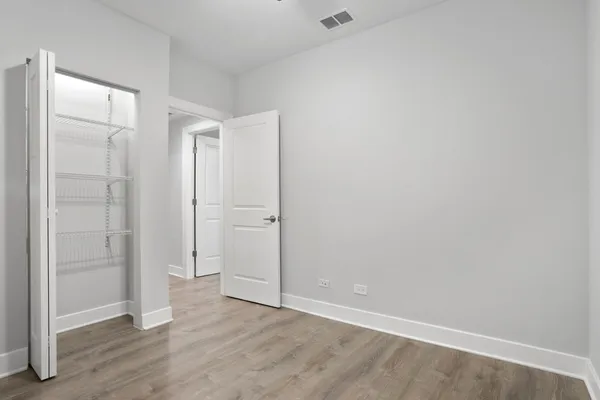 an empty room with wooden floor