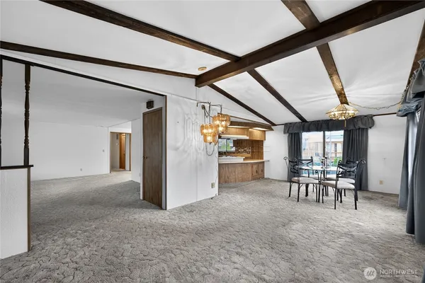 a view of a livingroom with furniture and a window