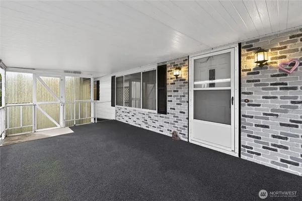 a view of empty room with windows