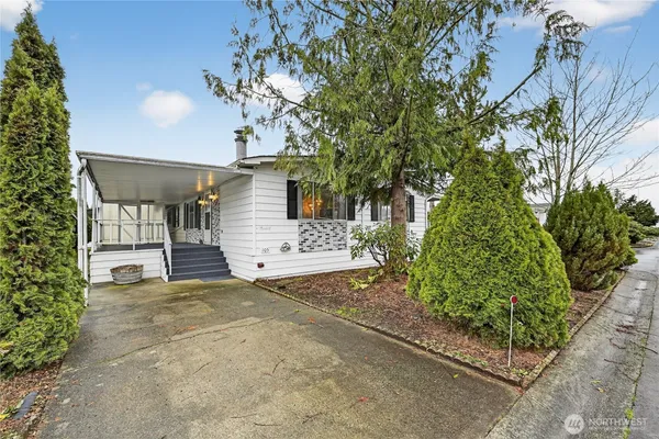 a view of a house with a tree