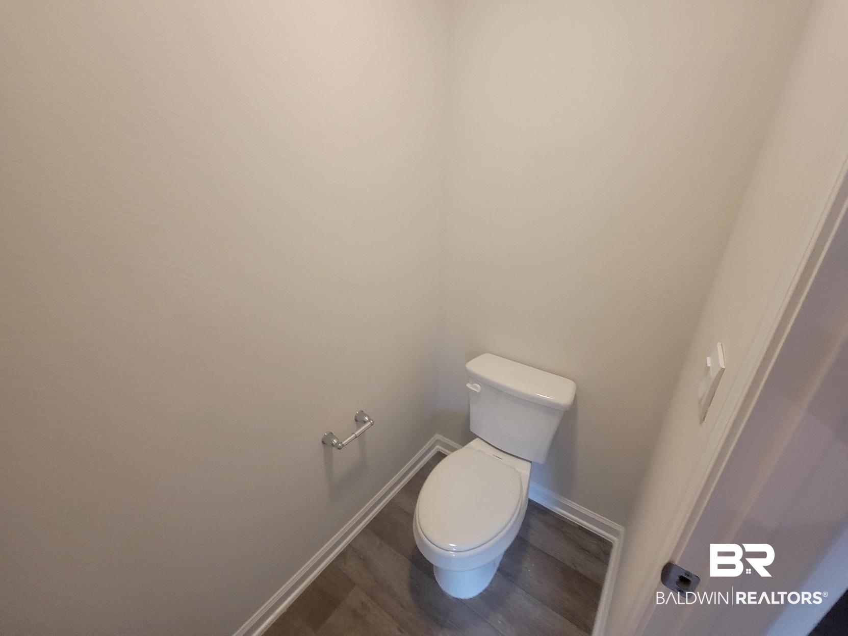 24625 Ponder Loop Loxley, AL 36551 - Photo 20 of 30 Bathroom featuring hardwood / wood-style floors and toilet