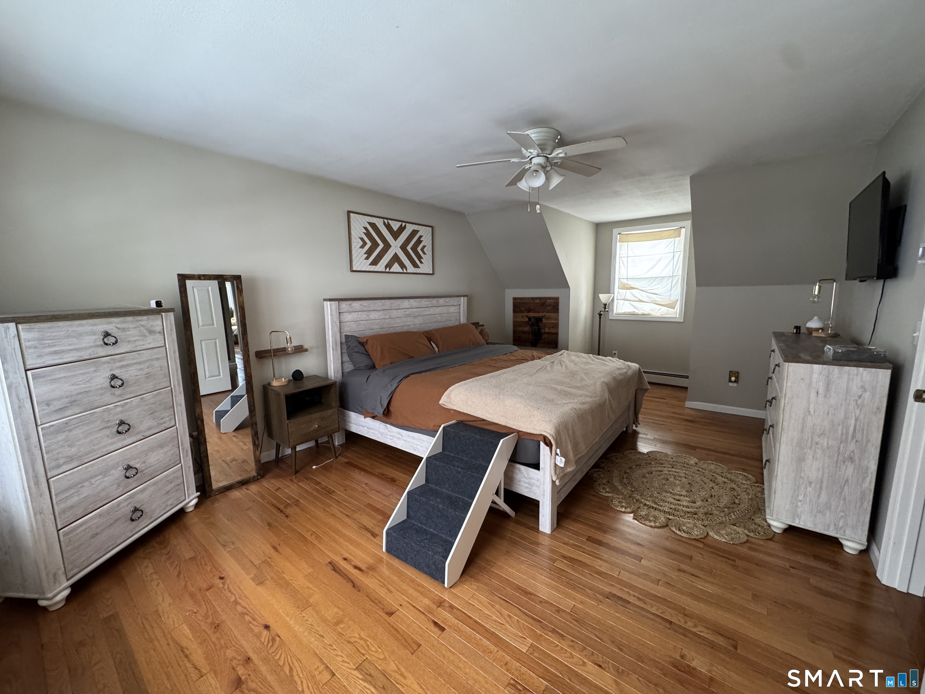 237 Chestnut Hill Road Killingworth, CT 06419 - Photo 21 of 39 a bedroom with furniture and a flat screen tv