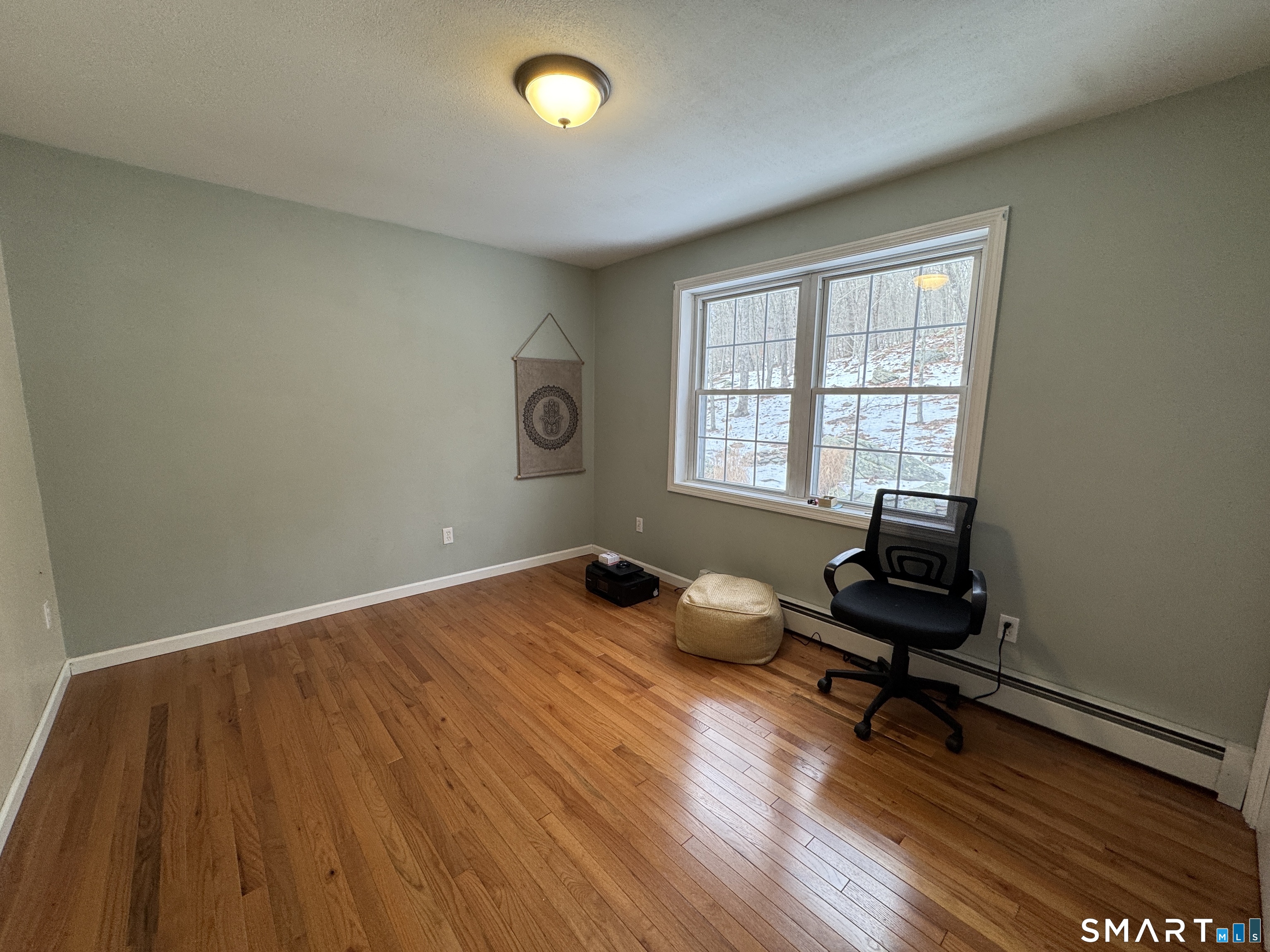 237 Chestnut Hill Road Killingworth, CT 06419 - Photo 27 of 39 a workspace with wooden floor and a window