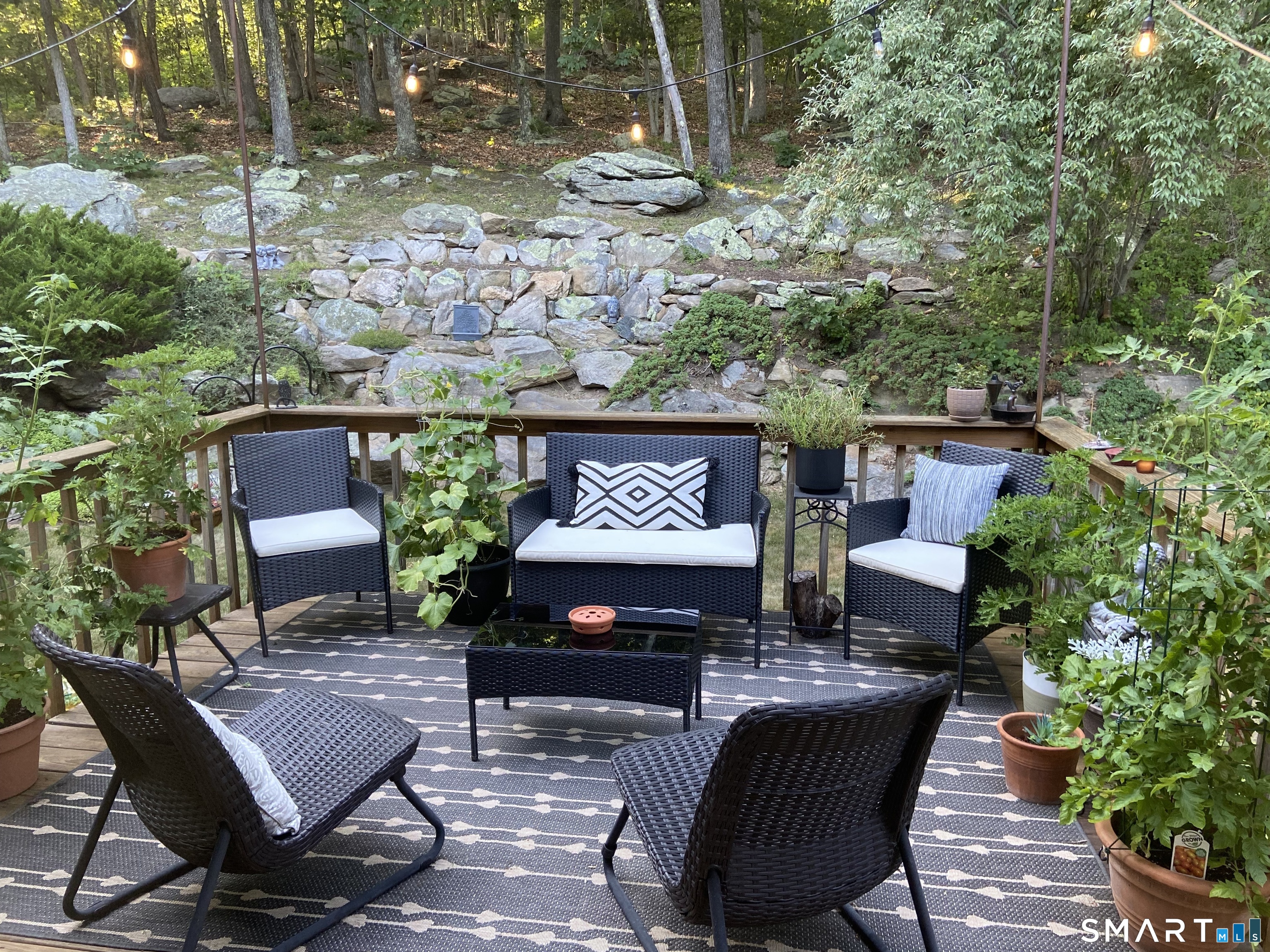 237 Chestnut Hill Road Killingworth, CT 06419 - Photo 30 of 39 a view of a chairs and table in a patio