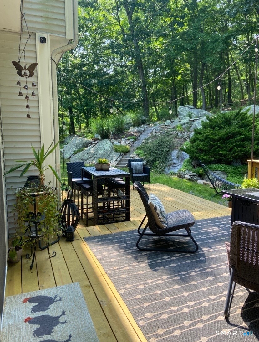 237 Chestnut Hill Road Killingworth, CT 06419 - Photo 31 of 39 a view of a chairs with a patio