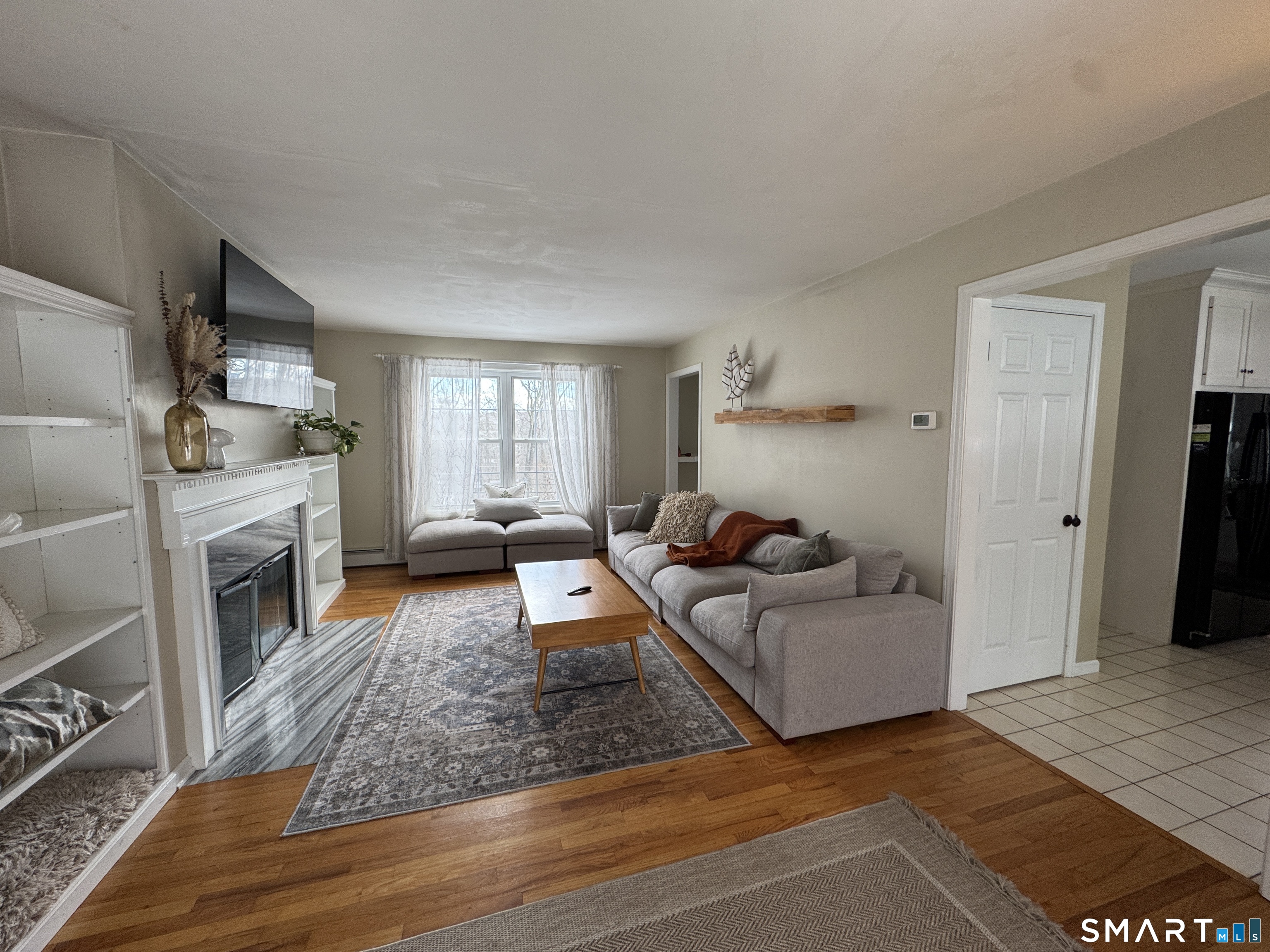 237 Chestnut Hill Road Killingworth, CT 06419 - Photo 4 of 39 a living room with furniture and a fireplace