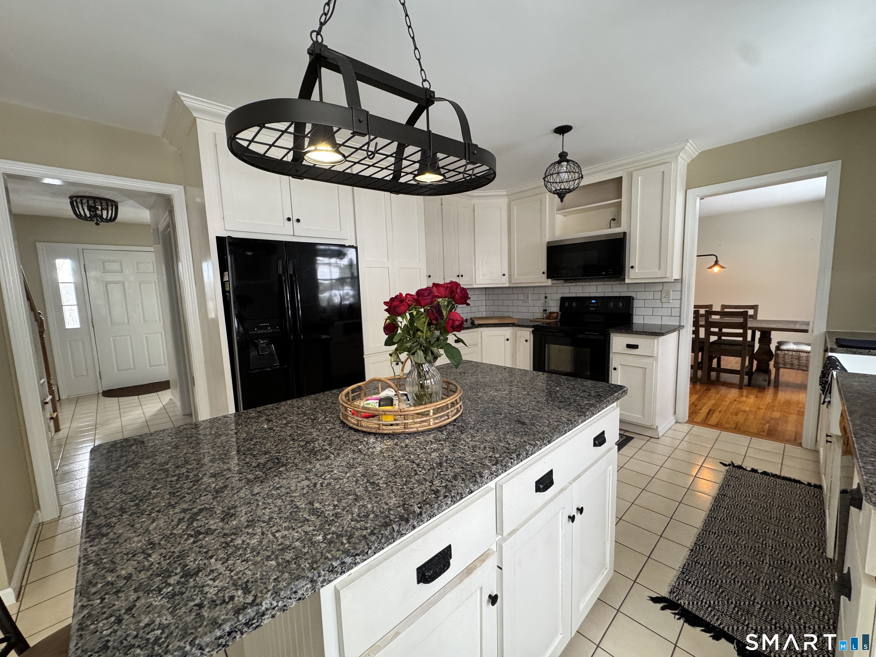 237 Chestnut Hill Road Killingworth, CT 06419 - Photo 7 of 39 a kitchen with stainless steel appliances granite countertop a sink a stove and refrigerator