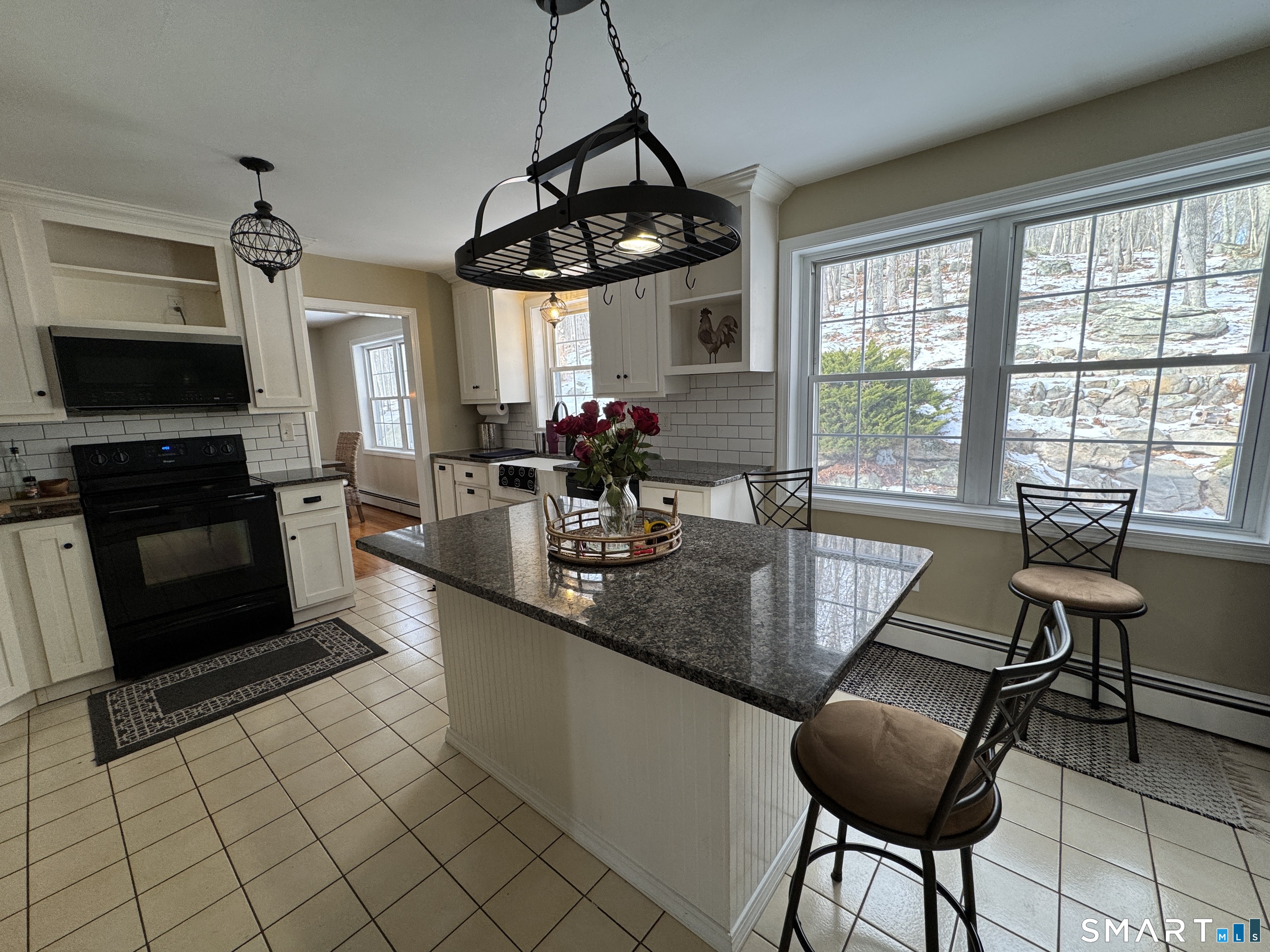 237 Chestnut Hill Road Killingworth, CT 06419 - Photo 8 of 39 a kitchen with stainless steel appliances granite countertop a sink counter space a window and cabinets