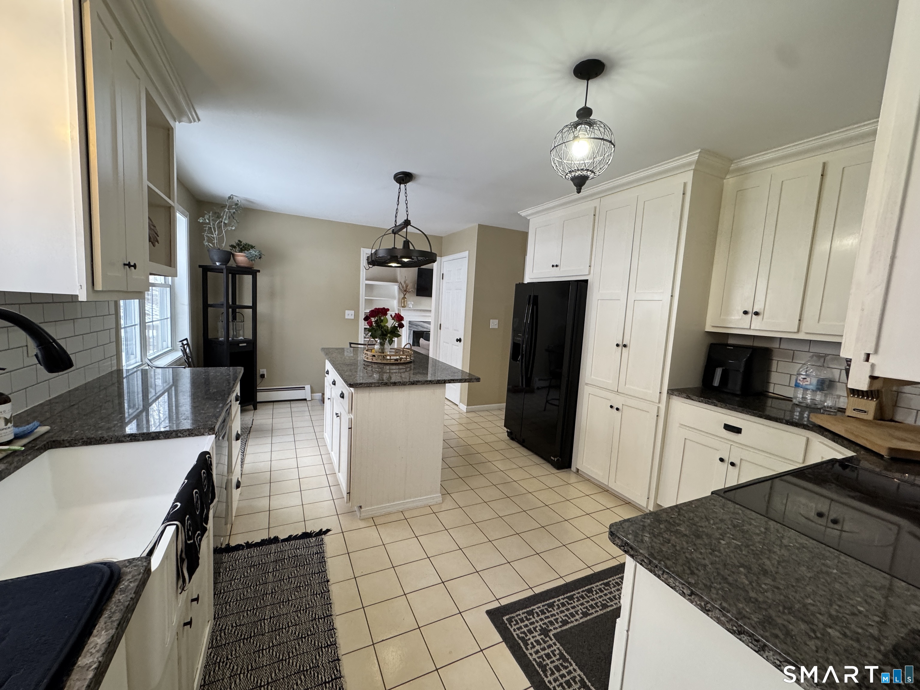237 Chestnut Hill Road Killingworth, CT 06419 - Photo 9 of 39 a kitchen with sink cabinets and refrigerator