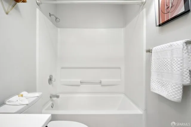 a bathroom with a bathtub and shower