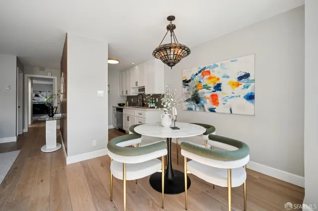 a kitchen with sink stove and cabinets