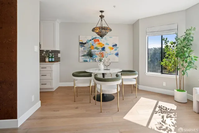 a kitchen with stainless steel appliances a stove a microwave and a refrigerator