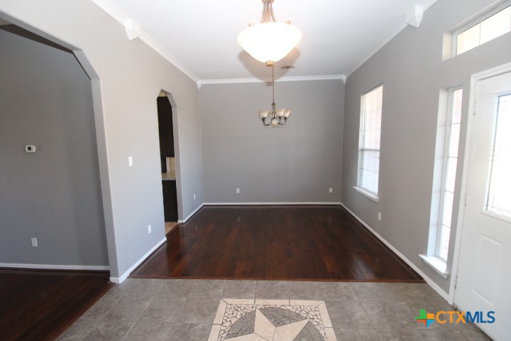 775 Cactus Lane Copperas Cove, TX 76522 - Photo 11 of 22 wooden floor in an empty room with a window